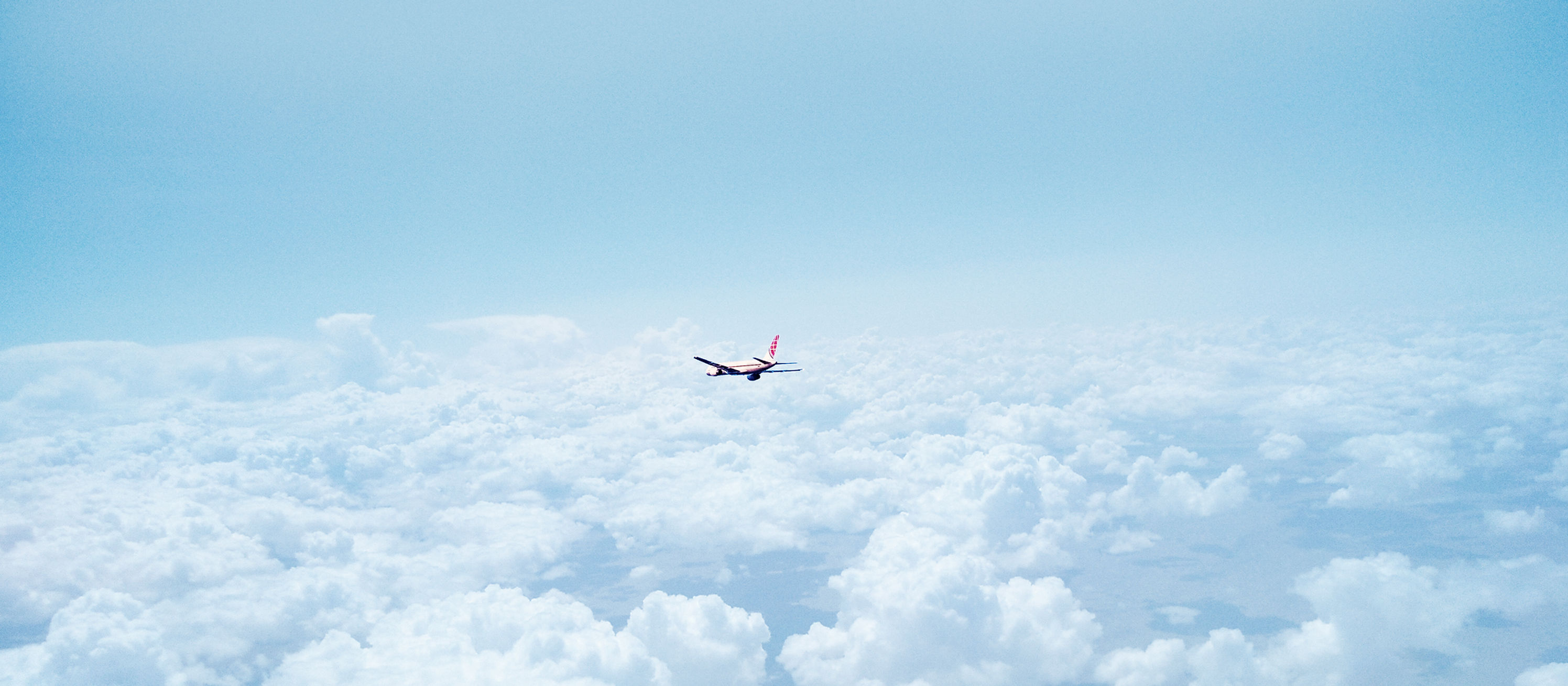 Airplane Above the Clouds